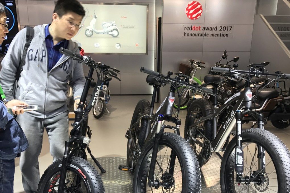 Visitors to the 2017 China International Bicycle & Motor Fair in Shanghai gaze at Tailg e-bikes Photo: Daniel Ren