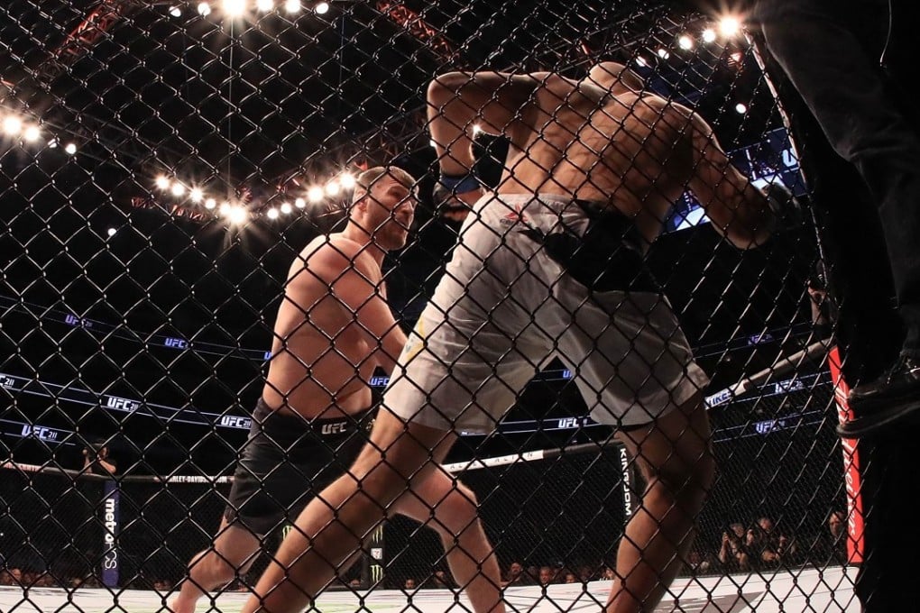 Stipe Miocic fights against Junior dos Santos in their heavyweight title bout during UFC 211 at American Airlines Centre. Photo: AFP