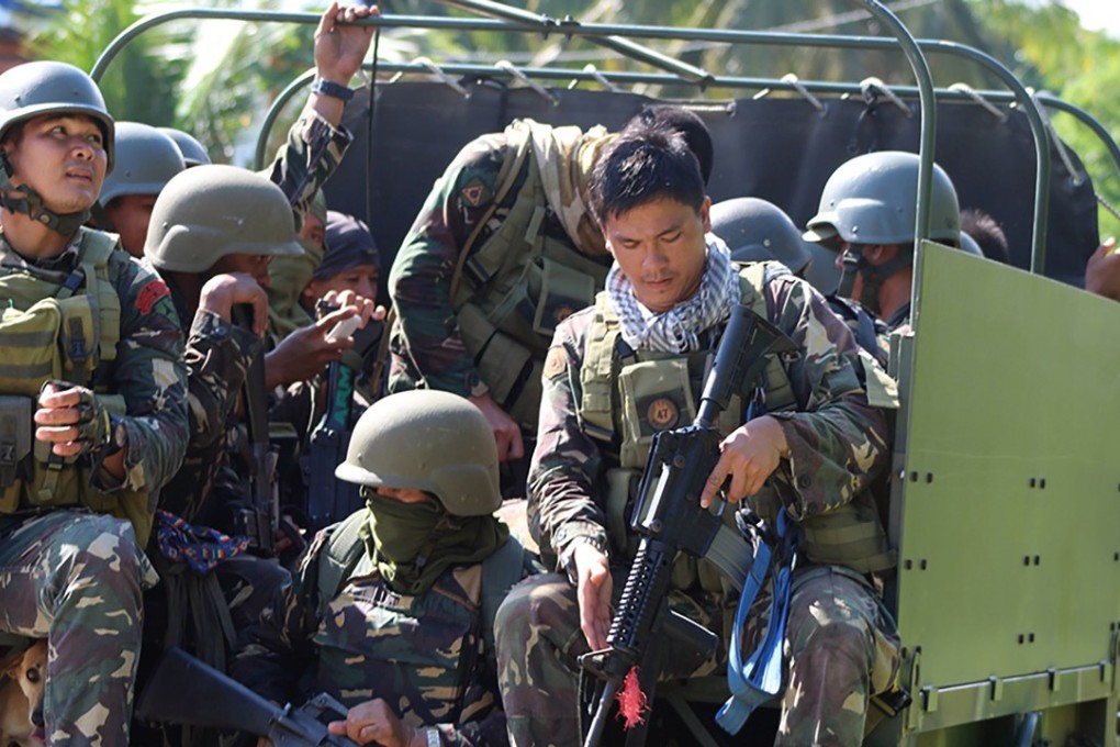 Philippine soldiers head to an area of unrest on Boho Island. Photo: EPA