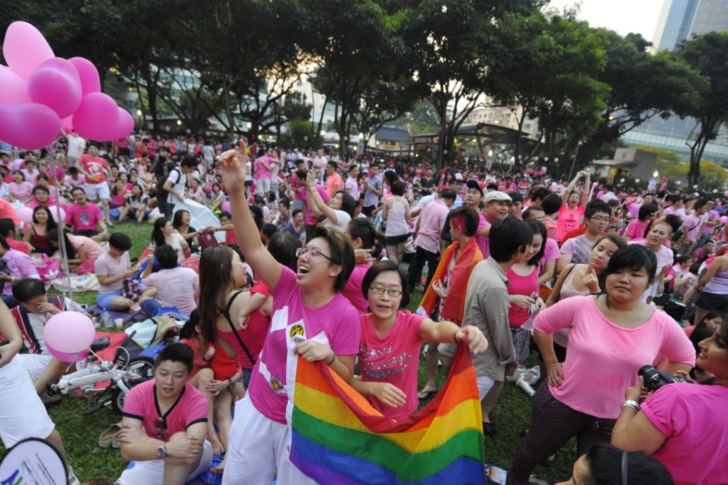 Two women cheer at a Pink Dot rally in support of gay rights in Singapore in 2013. Photo: AP