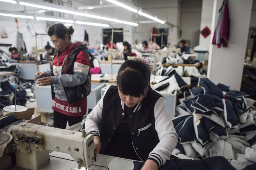 People work at a textile factory that will be relocated in Anxin, in China's Hebei province, on April 5, 2017. China will create a new special economic zone outside Beijing similar to those established in Shenzhen and Shanghai, the government said, in a bid to boost flagging growth and reduce the strain on the capital. Photo: AFP
