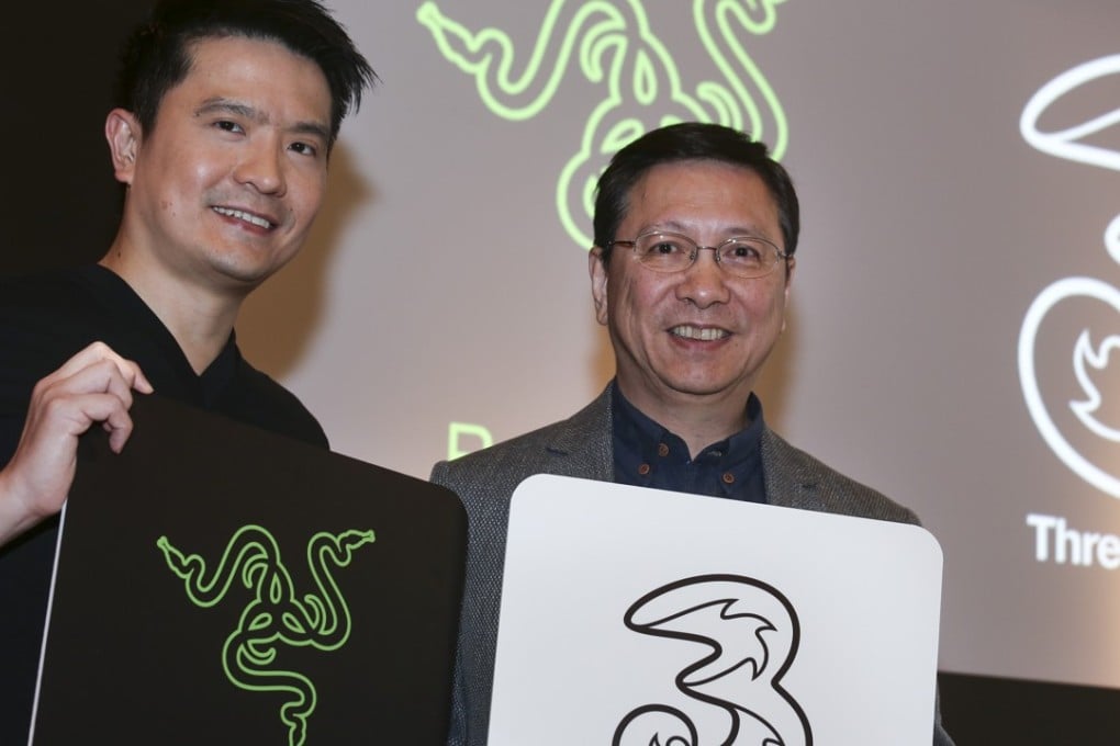 Razer chief executive Min-Liang Tan (left) and Hutchison Telecom CEO Cliff Woo Chiu-man at the launch of the partnership in Hong Kong on Monday. Photo: K.Y. Cheng