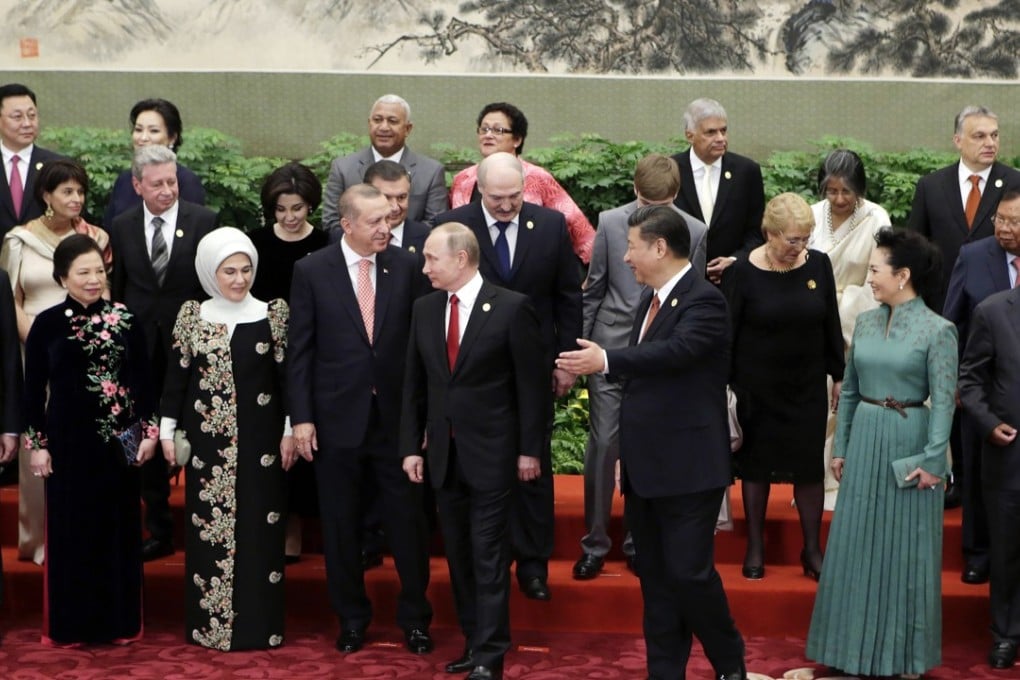 Showing the way: President Xi Jinping and other guests and delegates attend the welcoming banquet for the belt and road forum, in Beijing, on Sunday. Photo: AP