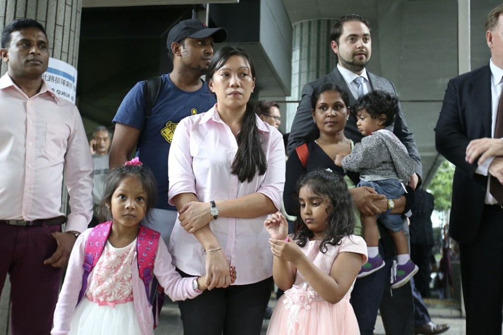 Lawyer Robert Tibbo (far right) with Ajith Pushpakumara, Vanessa Mae Rodel and her daughter, Supun Thilina Kellapatha (wearing cap) and his wife Nadeeka Dilrukshi Nonis and their children on Monday. Photo: David Wong