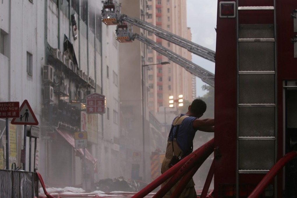 Firemen battle to put out the blaze at an industrial building in Ngau Tau Kok last June 25. Photo: Sam Tsang