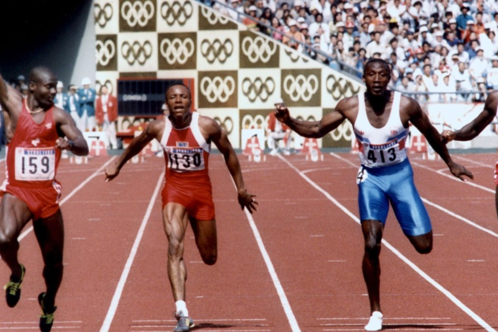 Ben Johnson (left) raises his arm in triumph after crossing the finish line first in the Seoul Olympics 100m final in 1988. Photo: AFP