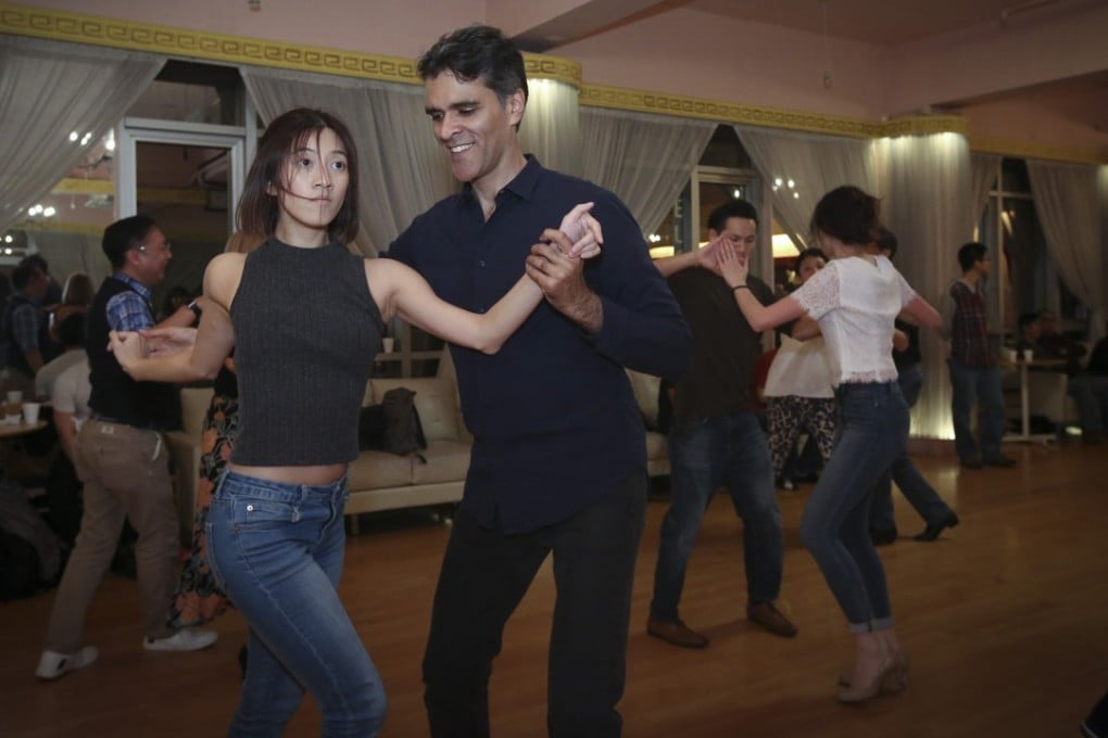 Dance teachers Sherman Mosquito (left) and Ricci Yasin (right) at a salsa dance party in Causeway Bay. Photo: Edmond So