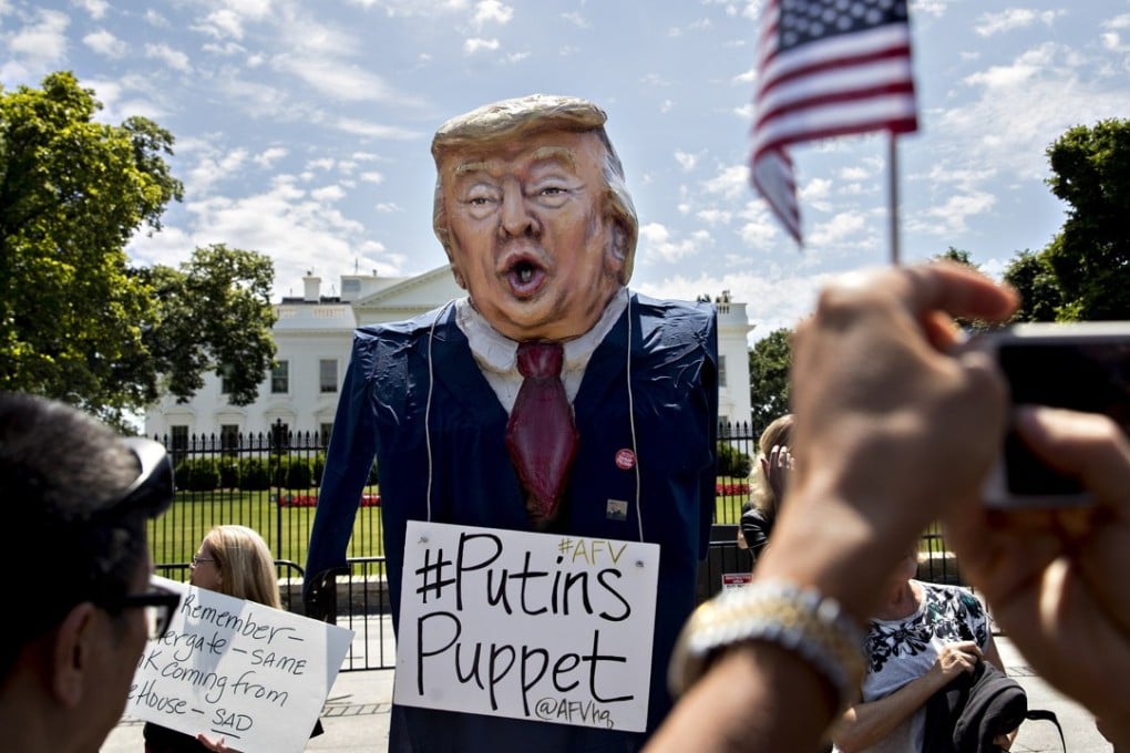 A demonstrator wears an effigy of US President Donald Trump with a sign that reads “Putin’s Puppet” outside the White House on May 10, the day Trump met with Russian Foreign Minister Sergei Lavrov. Photo: Bloomberg