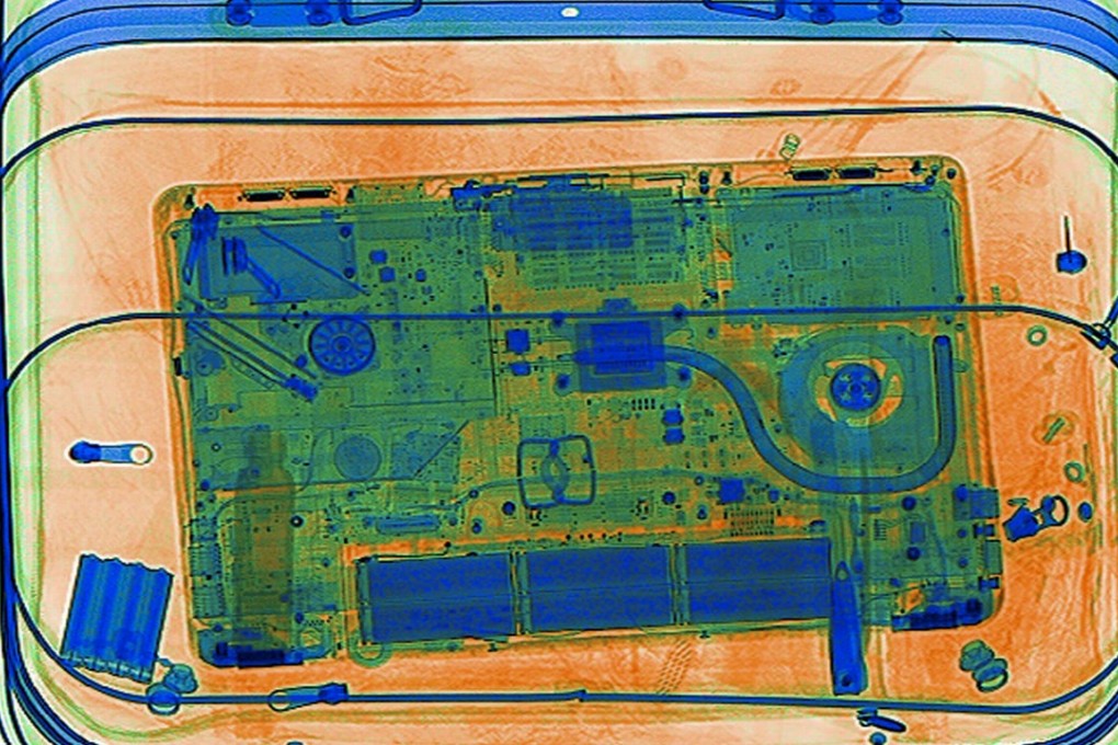 A laptop computer is seen on the screen of an X-ray security scanner. Photo: Reuters