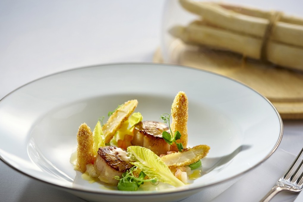 Hugo's panko-wrapped white asparagus with pan-seared Hokkaido scallops, romaine salad and basil aioli.