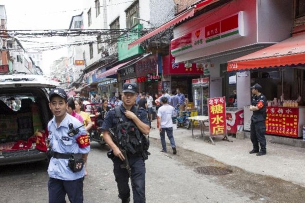 Police at the scene of the incident on Wednesday. The boy was reported to be conscious after a nine-hour operation. Photo: Handout