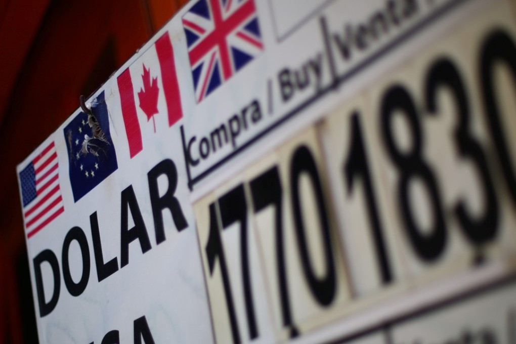 A board displaying exchange rates is seen at a foreign exchange house in Mexico City, Mexico. The dollar tumbled on talk that US President Donald Trump may face impeachment charges. Photo: Reuters
