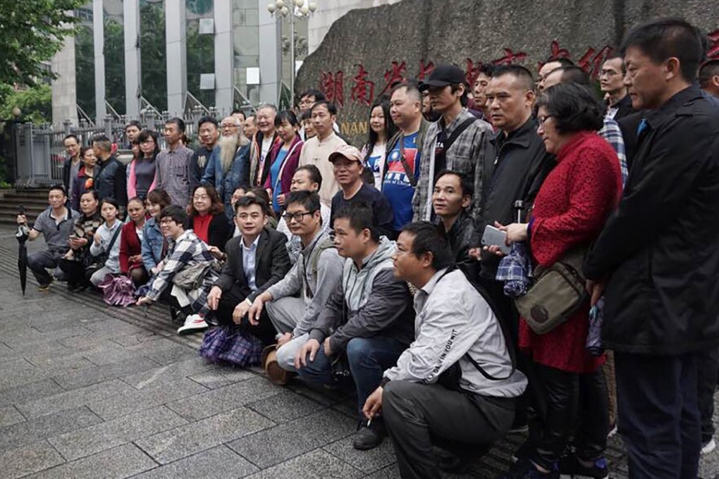 Supporters of detained lawyer Xie Yang gather outside the Intermediate People's Court in Changsha in April. Xie’s wife, Chen Guiqiu, was one of the women to speak at Thursday’s congressional hearing in Washington. Photo: AFP