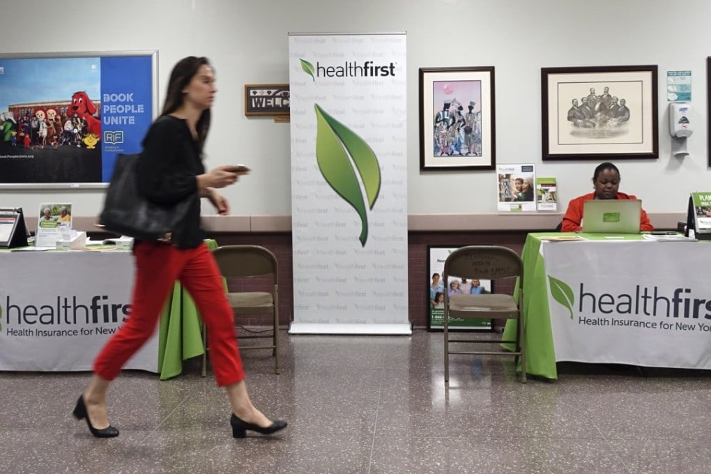 A woman walks past a health insurance counter at a hospital in New York this month. The US Republican-controlled House of Representatives this month pushed through a new version of the American Health Care Act aimed to repeal and replace major parts of Obamacare. The US has never had anything like universal coverage, yet even “Obamacare” – a piecemeal measure that narrows but does not close the uninsured gap – is vilified as a kind of Bolshevik plot to collectivise medicine. Photo: Xinhua