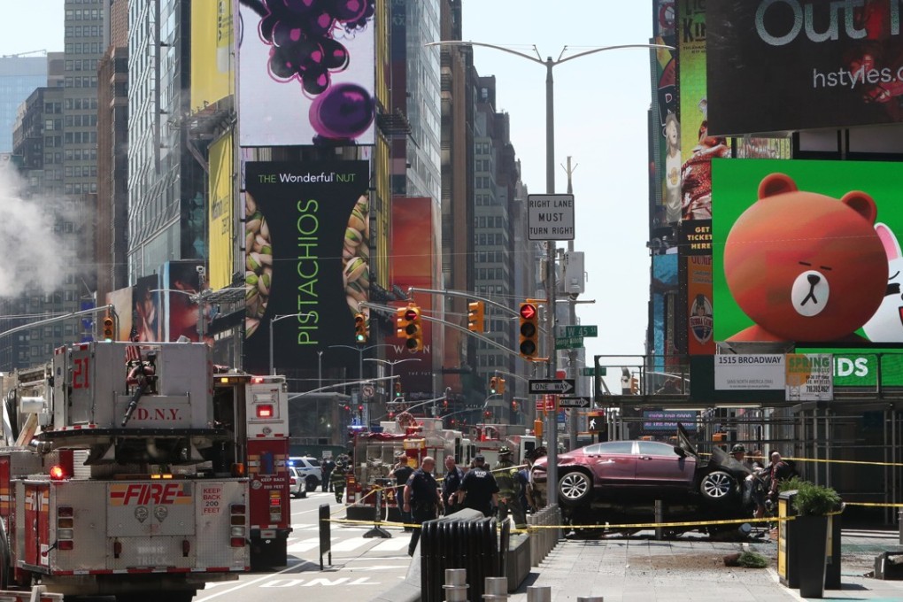 Emergency workers work at the scene after multiple people were injured when a car plowed into pedestrians in Times Square in New York City, New York. Authorities said there was no indication it was an act of terrorism. Photo: EPA