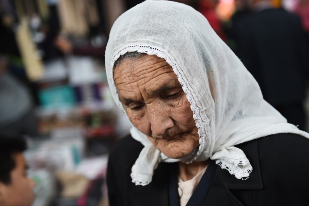 A Uygur woman at a bazaar in Kashgar, in China’s western Xinjiang region. Photo: AFP