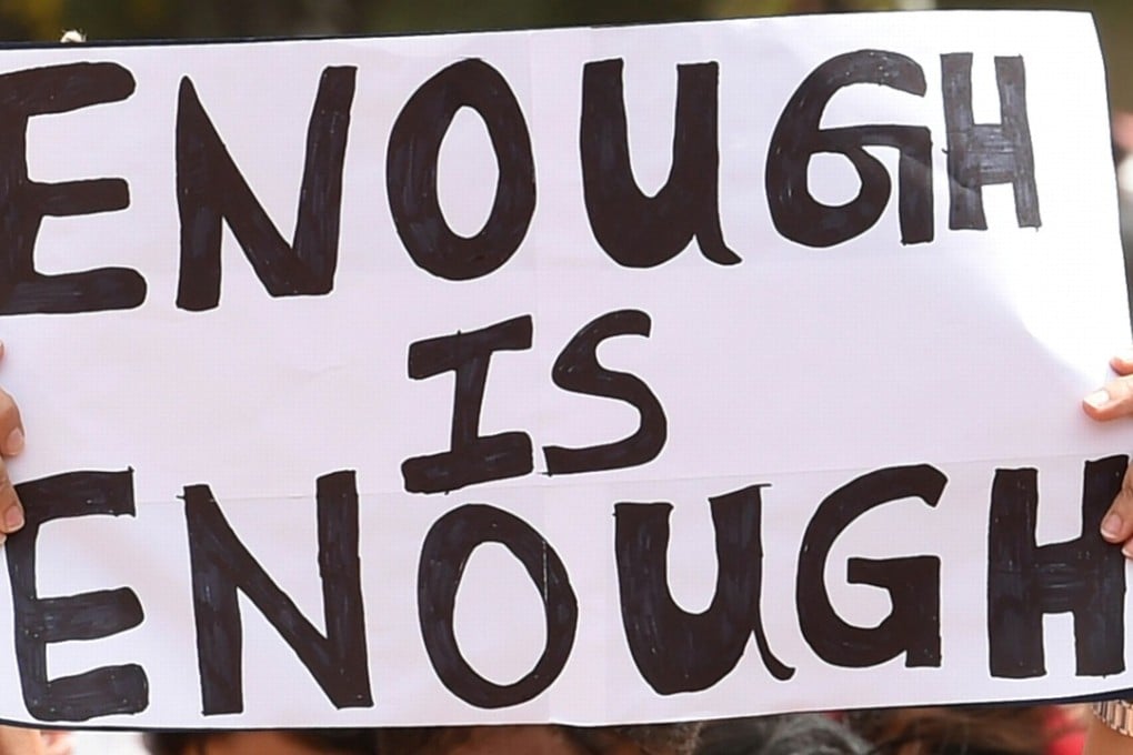 Indian activists hold placards during a rally to protest against the recent incidents of sexual abuse, molestation and rapes against women. Photo: AFP