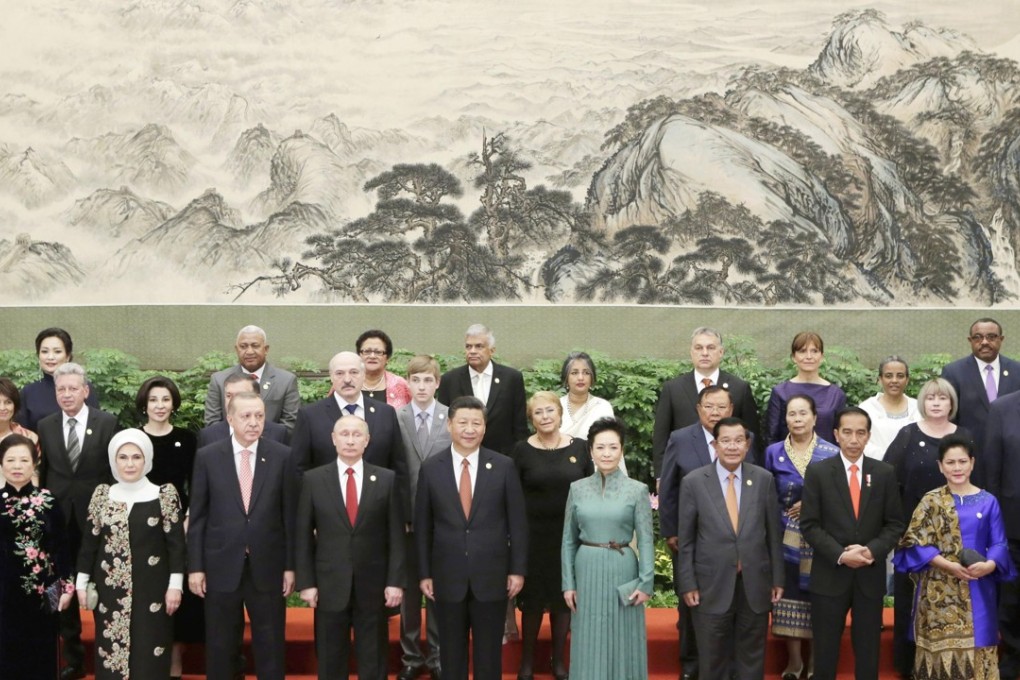 Chinese President Xi Jinping (centre) poses with leaders and delegates at the belt and road forum, in front of the giant landscape painting titled ‘This Land is So Rich in Beauty’. Photo: Kyodo