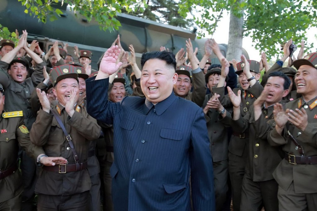 North Korean leader Kim Jong-un hails his latest missile launch. Photo: AFP