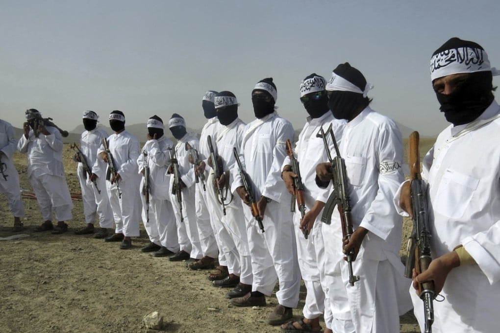 A file picture taken in August last year of Taliban suicide bombers standing guard during a gathering of a breakaway faction of the militant group in Zabul province, Afghanistan. Photo: Associated Press