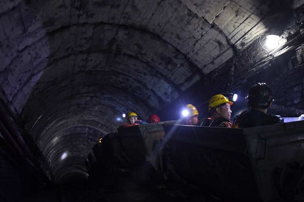Some analysts have advised investors to buy shares of Yanzhou Coal Mining, citing improving output and an upbeat coal-price outlook. Rescuers enter to work in the Jilinqiao coal mine in Huangfengqiao Town, Hunan province. Photo: Xinhua.