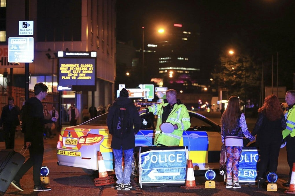 Emergency services work at Manchester Arena after an explosion at the venue during an Ariana Grande gig in Manchester, England Photo: AP