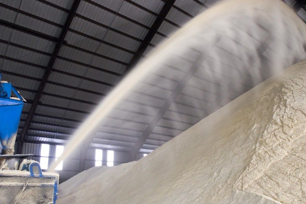 Raw sugar is blown into a warehouse. Chinese sugar imports for the first year will now be subject to a hefty 95 per cent tariff, a 45 per cent increase, which will decline to 90 per cent and later 85 per cent in the two subsequent years. Photo: Jack Kurtz