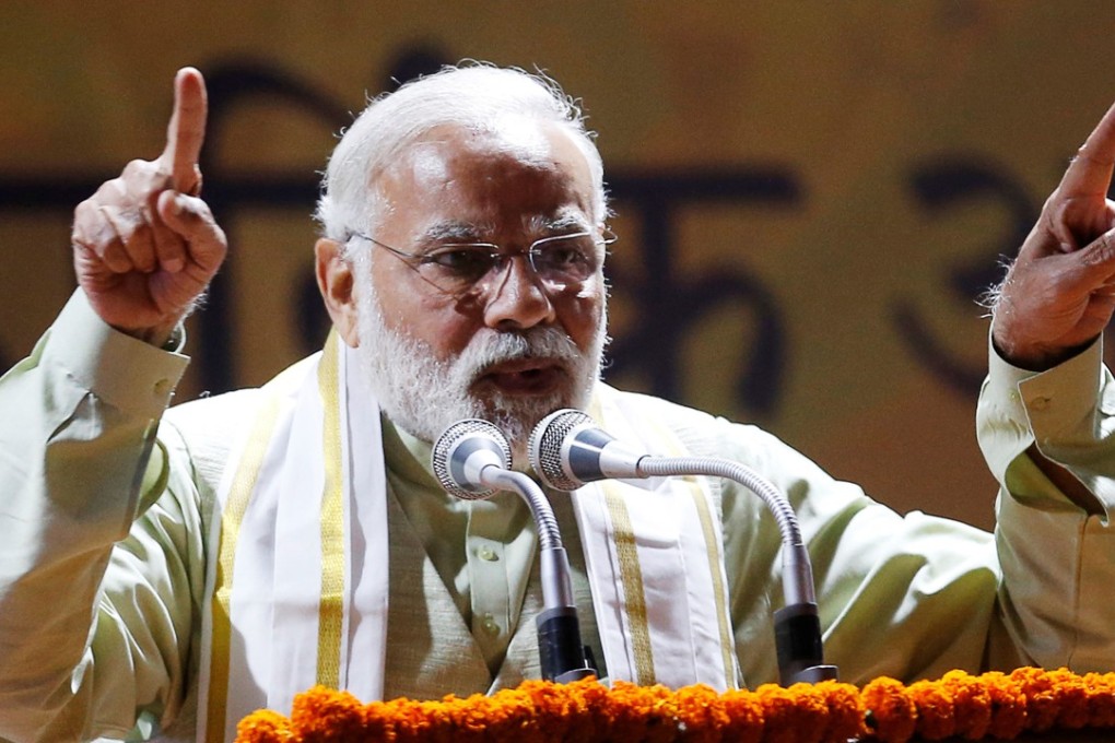 Prime Minister Narendra Modi of India addresses supporters at his Bharatiya Janata Party headquarters in New Delhi on March 12. Photo: Reuters