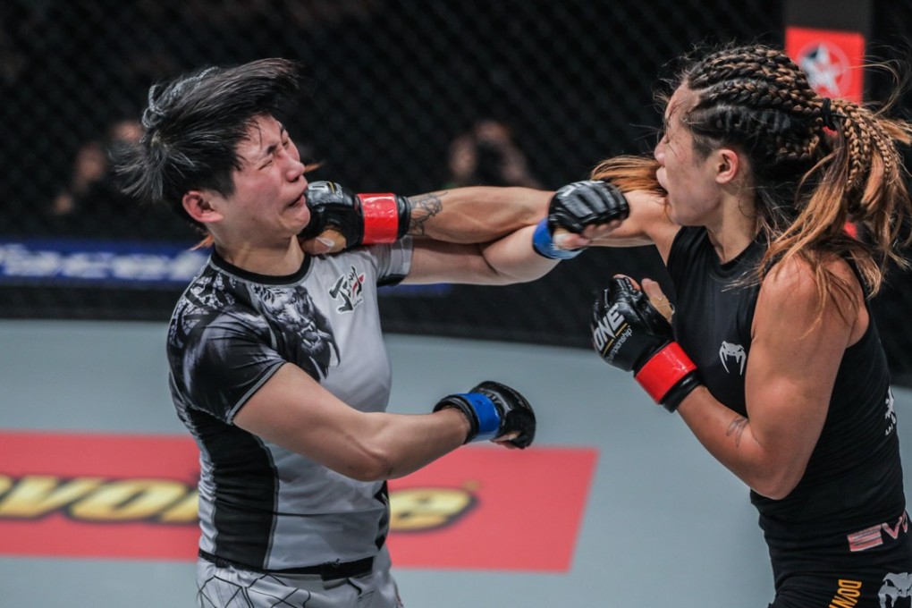 Angela Lee (right) rocks Jenny Huang of Taiwan with a right hand during their world MM title fight in March. Lee won by a knockout. Photo: ONE Championship