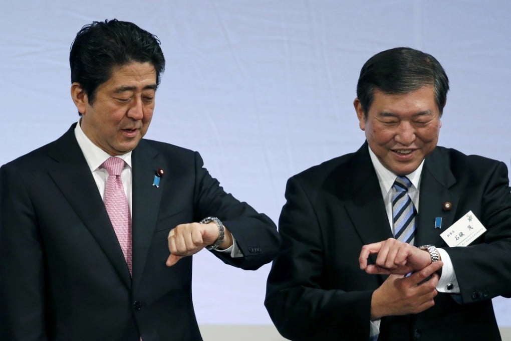 Shigeru Ishiba (right), a heavyweight of the ruling Liberal Democratic Party has started a gradual campaign to usurp Shinzo Abe as party leader and prime minister. Photo: AP