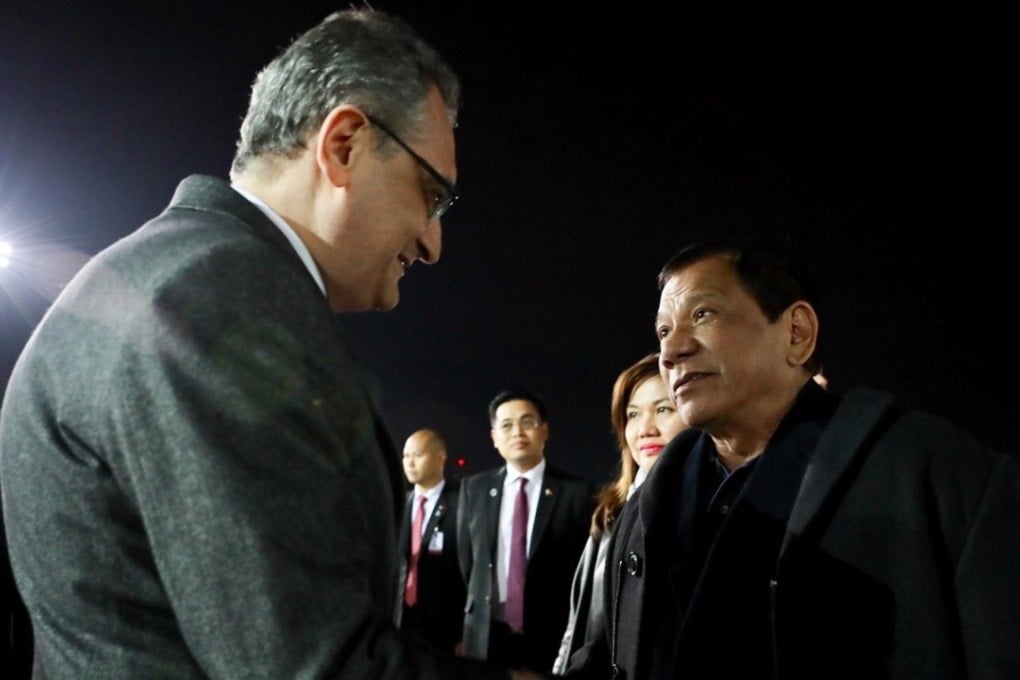 A handout photo made available by the Presidential Photographers Division (PPD) shows Filipino President Rodrigo Duterte (R) shaking hands with Russian Deputy Foreign Minister Igor Vladimirovich Morgulov (L) upon his arrival at Vnukovo-2 Airport in Moscow, Russia, on May 23, 2017. Duterte declared martial law in the entire Mindanao island amid the ongoing clashes between government troops and the Maute group of terrorists in Marawi City. Photo: EPA