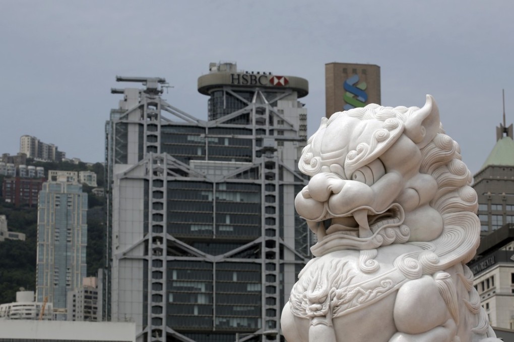 Moody's has cut its credit rating for Hong Kong, hours after downgrading China for rising debt levels, which it said would have "significant impact" on the Asian financial hub because of their close links. Photo: AP