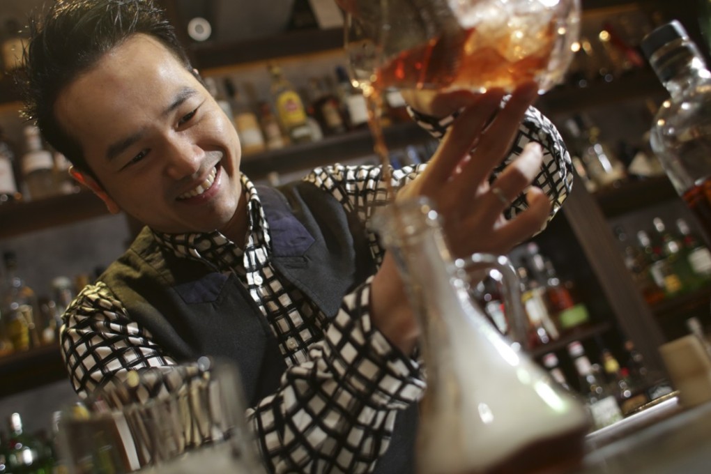 Antonio Lai Chun-nam makes a Smoked Black Pearl at his bar, Quinary in Central. Photo: May Tse