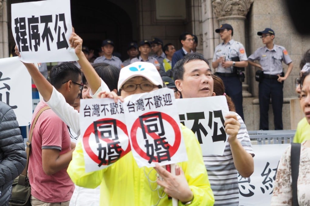 Demonstrators protest outside Taiwan’s constitutional court in Taipei after it ruled in favour of gay marriages. Photo: EPA