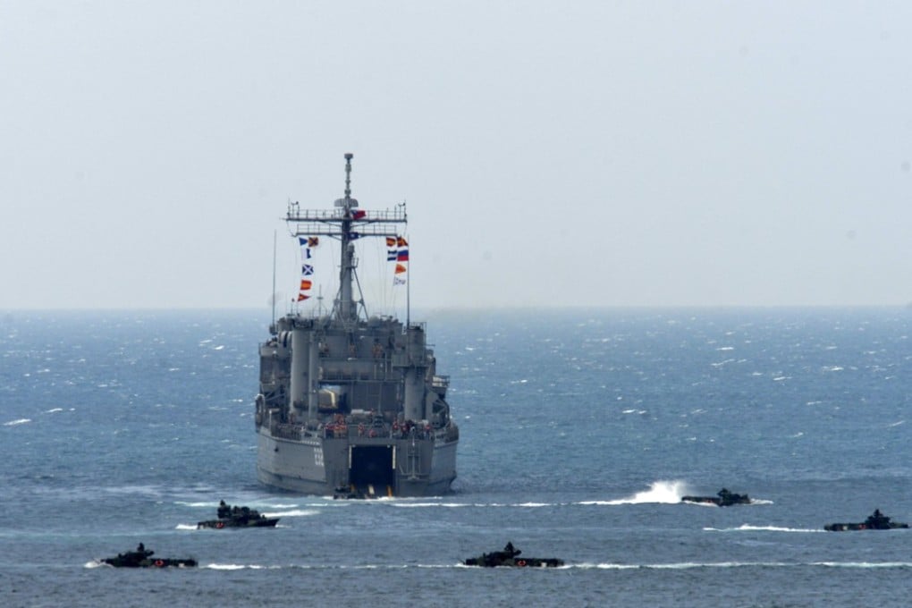A landing ship is surrounded by amphibious assault vehicles during the training exercise. Photo: AFP