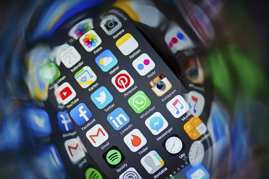 Apps, including dating ones, have helped LGBT people connect and learn, especially in places where being gay is illegal. Grindr is the world’s largest LGBT social network app with users in nearly 200 countries. Photo: Corbis