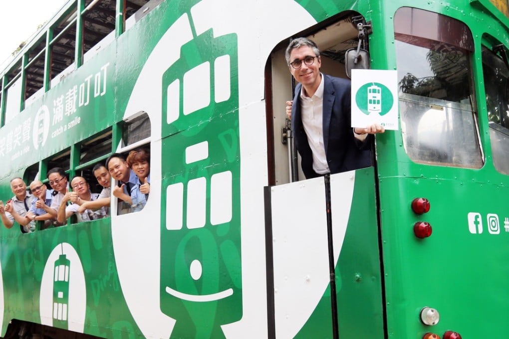Hong Kong Tramways managing director Emmanuel Vivant (right) and staff members introduce the new logo. Photo: Dickson Lee