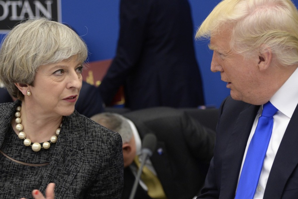 US President Donald Trump, right, speaks with British Prime Minister Theresa May as they participate in a working dinner meeting, during the NATO summit of heads of state and government, at the NATO headquarters. May plans to argue at the G7 summit that internet companies such as Google and Facebook should do more to fight terror. Photo: Pool via AP