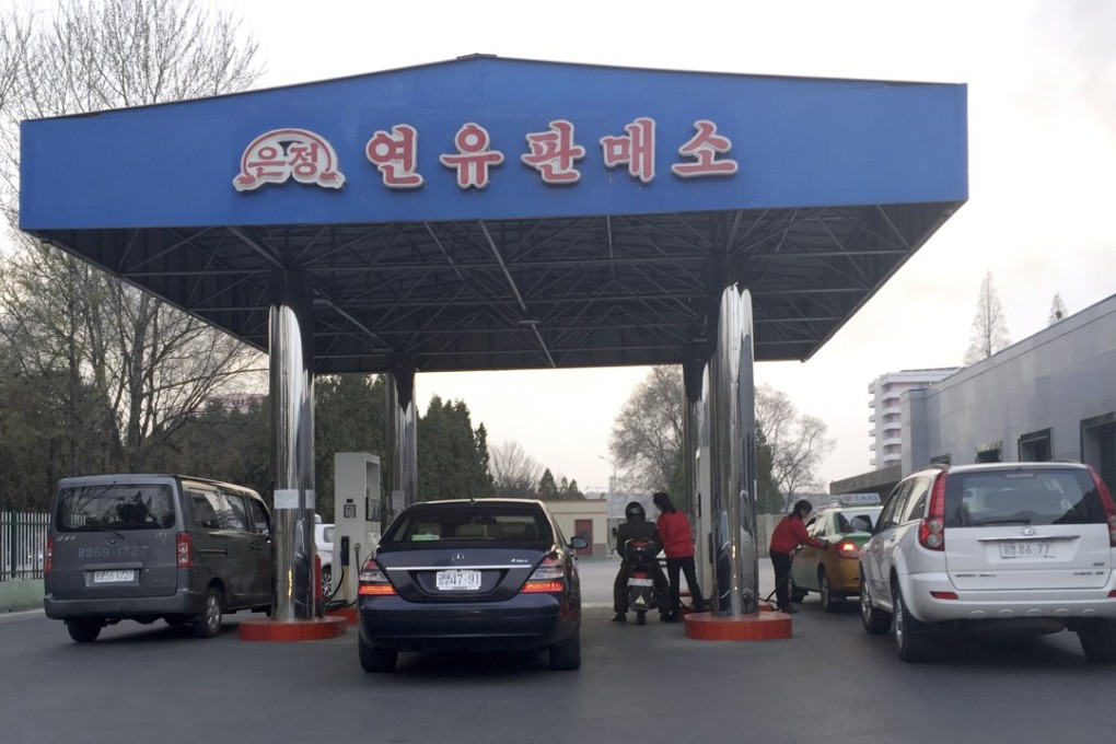 Cars line up at the pumps at a petrol station in Pyongyang. Photo: AP