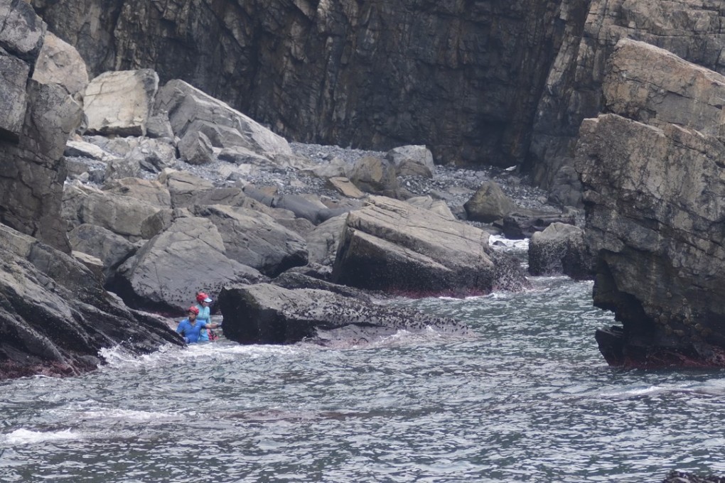 Esther Röling and Paul Niel navigate the swell on the rugged eastern shoreline between Cape Collinson lighthouse and Cape Collinson Correctional Institution. Photo: Michael Sakas.