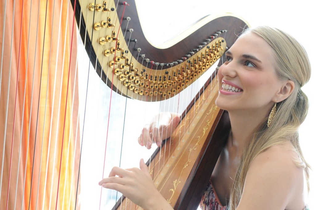 Juliana Beckel plays the harp, which represents the river, in The Beat of the Dragon Boat, a work for a mix of Eastern and Western instruments that celebrates the Tuen Ng (Dragon Boat) Festival and will be performed in two concerts on Sunday.