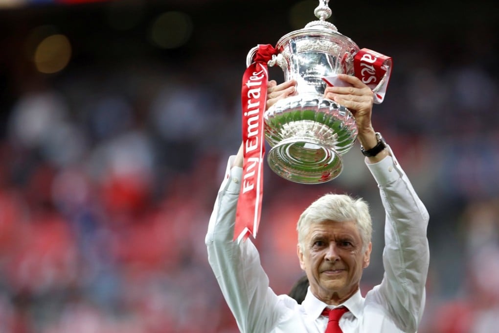 Arsenal manager Arsene Wenger celebrates with the trophy after winning the FA Cup finalAction. Photo: Reuters