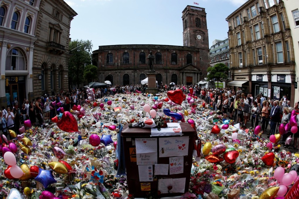 Floral and handwritten tributes for the victims of the Manchester Arena attack, at St Ann’s Square in central Manchester, on May 27. Photo: Reuters