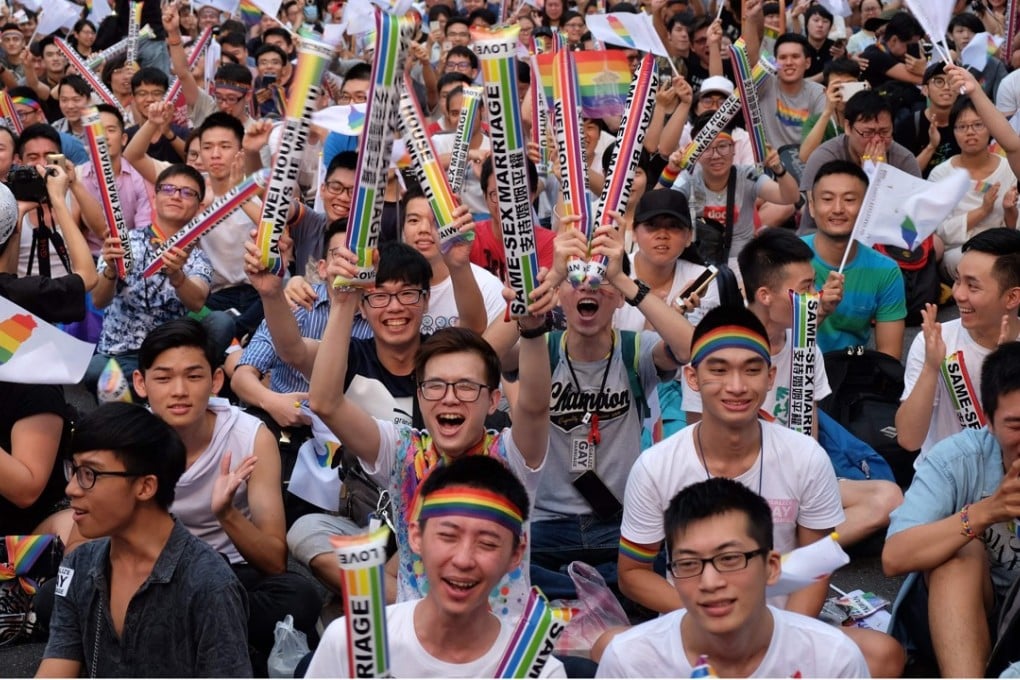 Same-sex activists cheer as they celebrate the landmark decision by the top court in Taipei, paving the way for Taiwan to become the first place in Asia to legalise gay marriage, on May 24. Photo: AFP