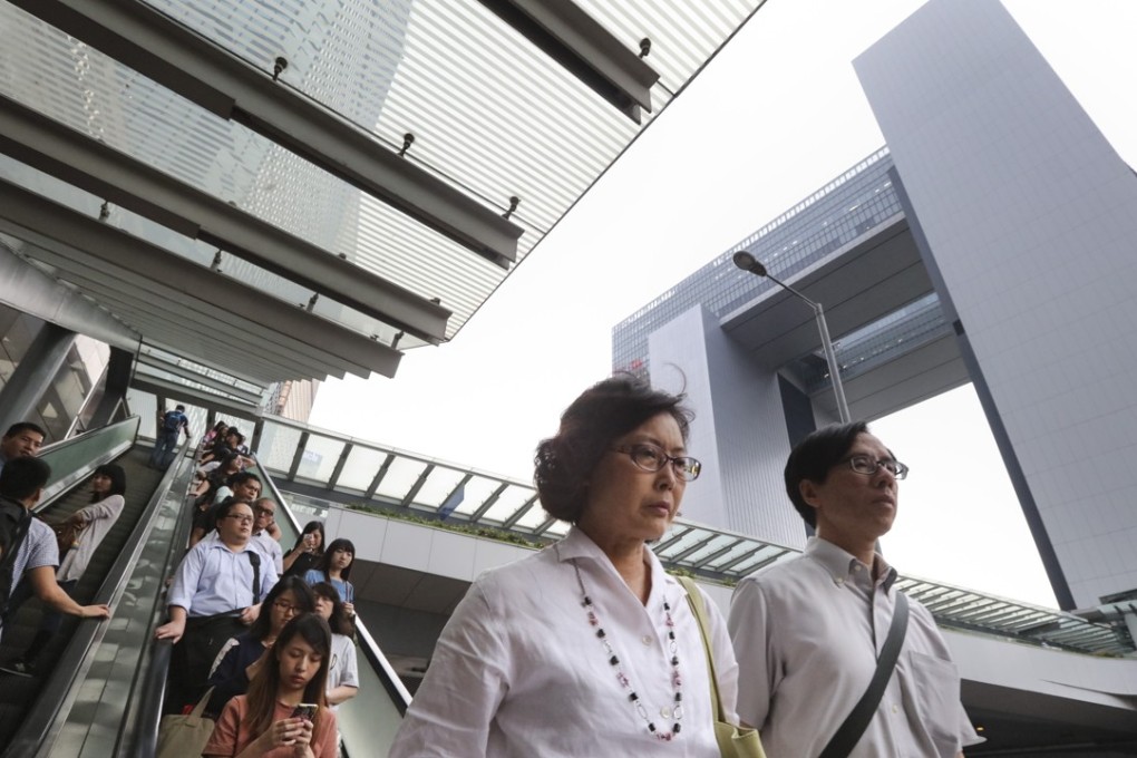Cvil servants outside government headquarters in Tamar. Photo: Felix Wong