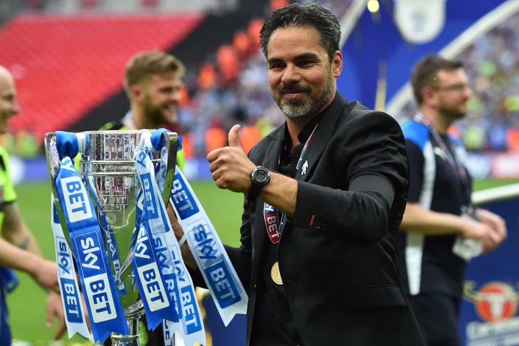 Huddersfield Town’s German head coach David Wagner holds the Championship Play-off trophy. Photo: AFP