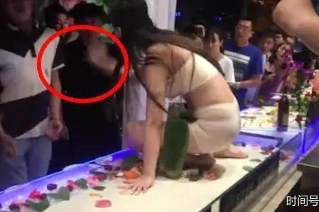 The woman seen striking the customer. Photo: Handout