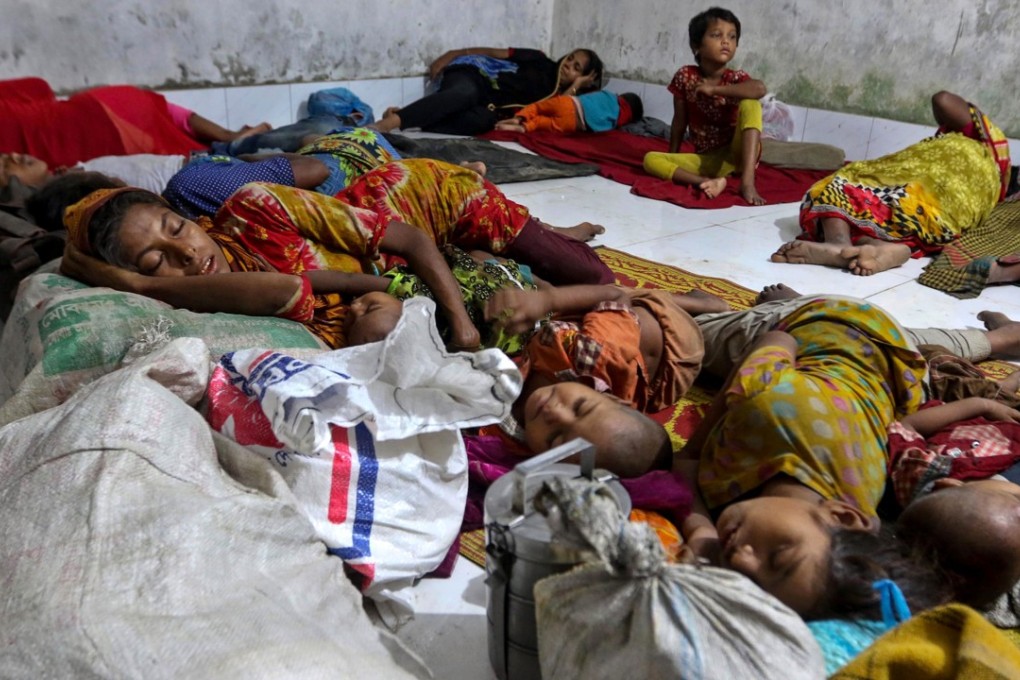 Bangladeshi villagers sleep in a cyclone shelter. Photo: AFP