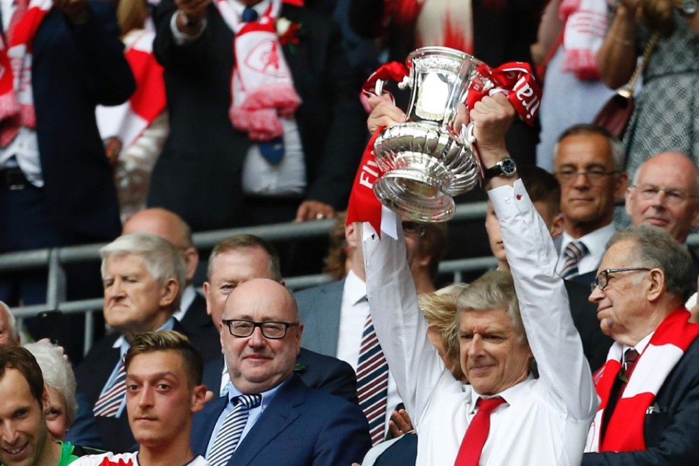 Arsene Wenger lifts the FA Cup after their win over Chelsea at Wembley. Photo: AFP