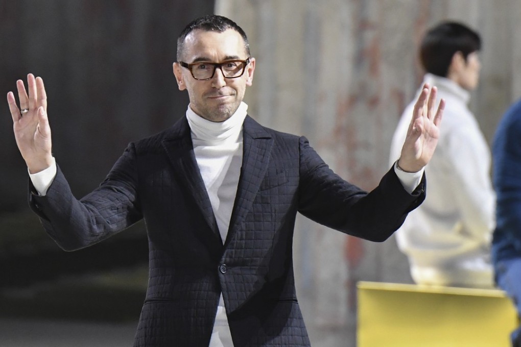 Alessandro Sartori greets the audience at the end of his debut show as artistic director for Ermenegildo Zegna. Photo: AFP